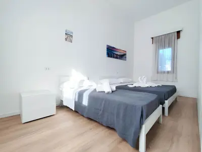 Letto o letti in una camera di Ariston Superior Fronte Mare