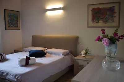 Letto o letti in una camera di A casa di Jolanda, indipendent house near historic Venice center with private parking and wide and fenced garden