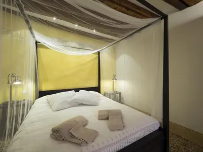 Letto o letti in una camera di Casa Margherita by Wonderful Italy