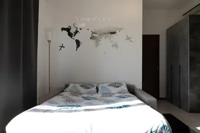 Letto o letti in una camera di San Marco Apt - Loft a 5 minuti dall'aeroporto con parcheggio privato interno