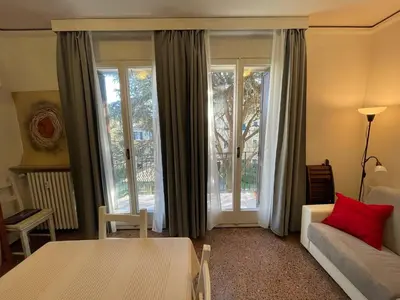 Letto o letti in una camera di GRANDMA MARY Appartamento nel verde con Ascensore Balcone AC Internet Veloce GIUDECCA VENEZIA