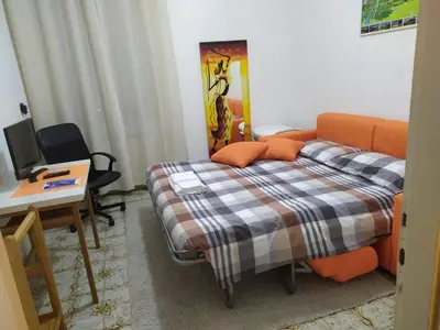Letto o letti in una camera di Il Giardino dei Ciliegi appartamento con 3 camere