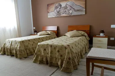 Letto o letti in una camera di B&B La Rinascita