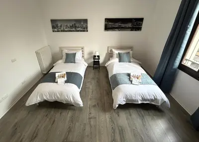 Letto o letti in una camera di Lovely Bridge View Apartment Close to Padua City Center