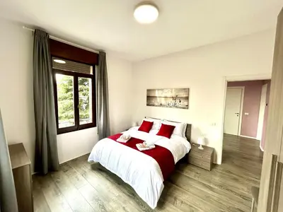 Letto o letti in una camera di Lovely Bridge View Apartment Close to Padua City Center