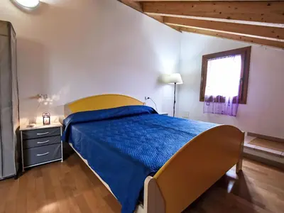 Letto o letti in una camera di Apartment Solmare-54 by Interhome