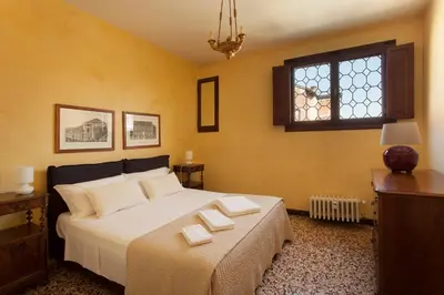 Letto o letti in una camera di Palazzo Valmarana