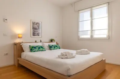 Letto o letti in una camera di Francesco & Giulia - attico n 11 Treviso Stazione