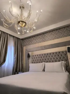 Letto o letti in una camera di Cà dell'Arte Boutique