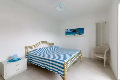 Letto o letti in una camera di Residence Le Mediterranee