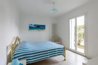 Letto o letti in una camera di Residence Le Mediterranee