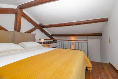Letto o letti in una camera di Dimora Collegio San Marco
