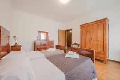Letto o letti in una camera di Residence Gerlin - 10 minuti da Valdobbiadene & Parking
