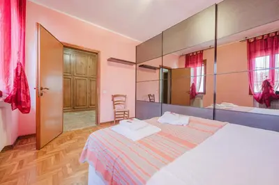 Letto o letti in una camera di Residence Gerlin - 10 minuti da Valdobbiadene & Parking