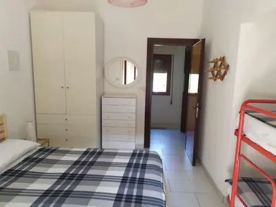Letto o letti in una camera di Marta