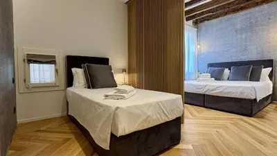 Letto o letti in una camera di Rialto Prestige Canal View