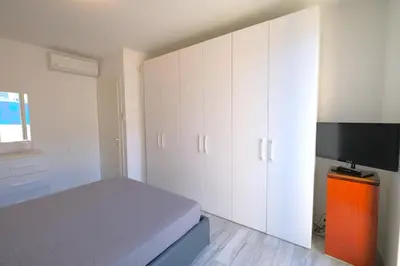 Letto o letti in una camera di Wave Village Piazza Trieste