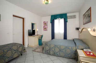 Letto o letti in una camera di Hotel Elpiro