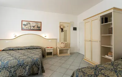 Letto o letti in una camera di Hotel Elpiro