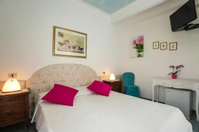 Letto o letti in una camera di Hotel Elpiro
