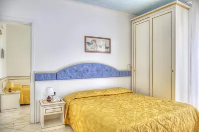 Letto o letti in una camera di Hotel Elpiro