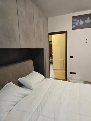 Letto o letti in una camera di B&B Via Pitagora