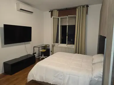 Letto o letti in una camera di B&B Via Pitagora