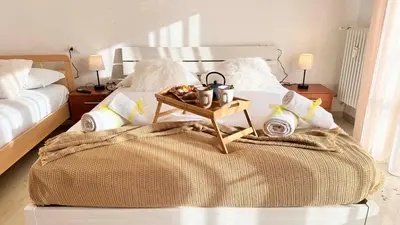 Letto o letti in una camera di Casa Dora by Ca-Sa Check
