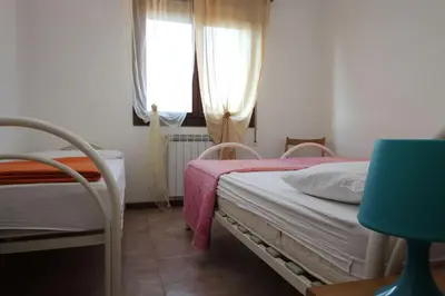Letto o letti in una camera di Flat 150m from the beach of Rosolina