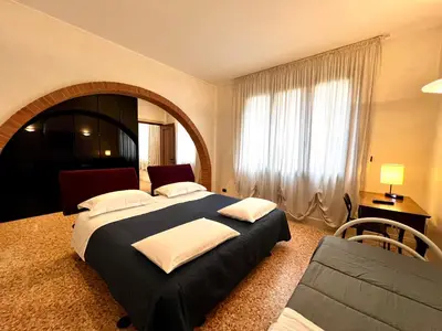Letto o letti in una camera di Locazione Turistica Joyful Padova