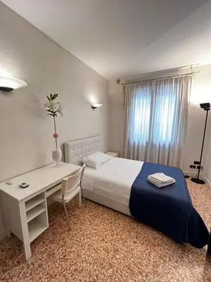 Letto o letti in una camera di Locazione Turistica Joyful Padova