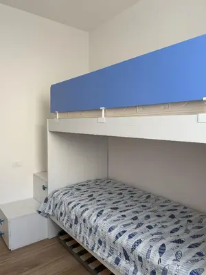 Letto o letti in una camera di GREEN APARTMENT-Solo per famiglie-WALTERIGATO APARTMENTS