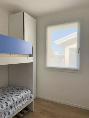 Letto o letti in una camera di GREEN APARTMENT-Solo per famiglie-WALTERIGATO APARTMENTS