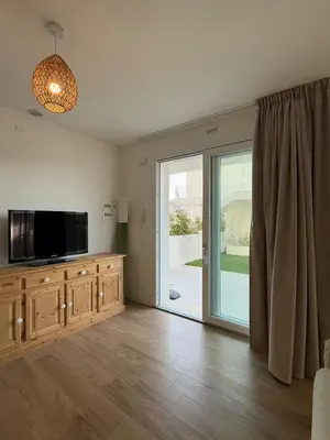 TV o dispositivi per l'intrattenimento presso GREEN APARTMENT-Solo per famiglie-WALTERIGATO APARTMENTS