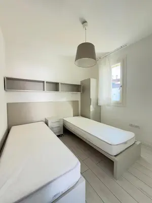 Letto o letti in una camera di RESIDENCE WAVE 1-Solo per famiglie- WALTERIGATO APARTMENTS