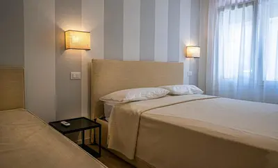 Letto o letti in una camera di Villa Oleandro Family Apartments-Leresidenzedijesolo