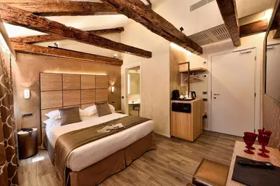 Letto o letti in una camera di Rosa Salva Hotel