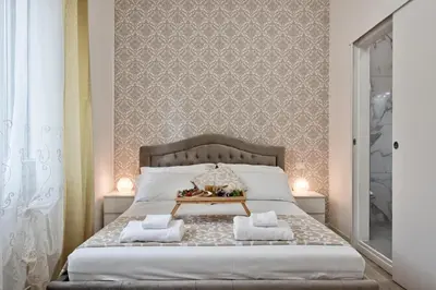 Letto o letti in una camera di La Venezia Station Residence Mestre