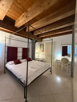 Letto o letti in una camera di Molino Stucky Chimera - Canal View