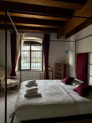 Letto o letti in una camera di Molino Stucky Chimera - Canal View