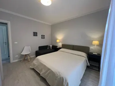 Letto o letti in una camera di Villa Giulia Family Apartments- LeresidenzediJesolo