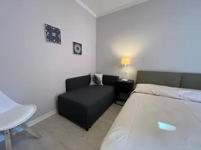 Letto o letti in una camera di Villa Giulia Family Apartments- LeresidenzediJesolo