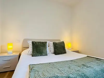 Letto o letti in una camera di Cozy Apartment 10 min to Venice by Tram & Free Parking