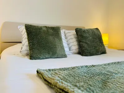 Letto o letti in una camera di Cozy Apartment 10 min to Venice by Tram & Free Parking