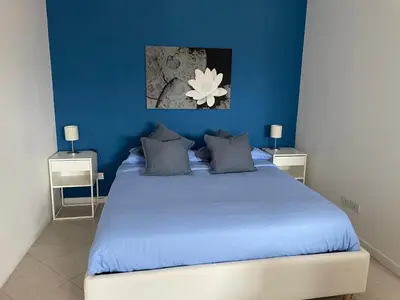 Letto o letti in una camera di QUEEN HOME VENICE TRAIN STATION Noemi & Angel