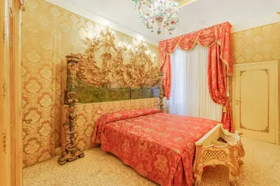 Letto o letti in una camera di Canal View San Marco Rialto - Dogaressa Palace 1872