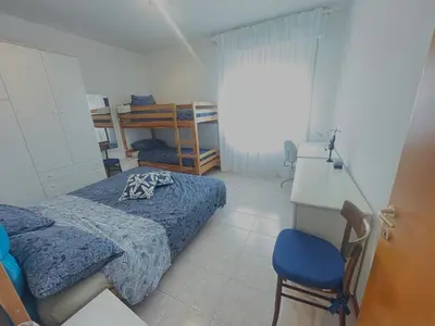 Letto o letti in una camera di Appartamento ALGHE ROSSE PLUS
