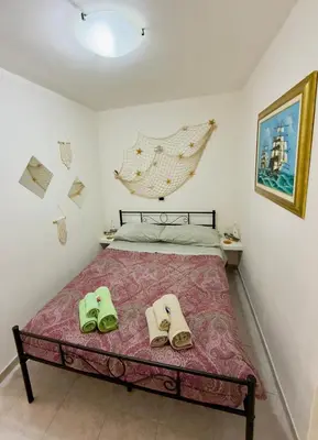 Letto o letti in una camera di Casa Gioia