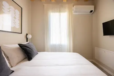 Letto o letti in una camera di PALAZZO CIVIDALE Central Luxury Apartment B