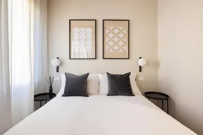 Letto o letti in una camera di PALAZZO CIVIDALE Central Luxury Apartment A